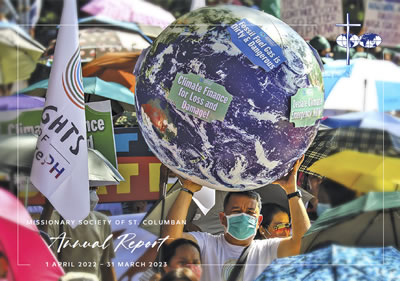 Lay missionary holding a globe during a march