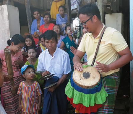 Columban Fr. Kurt Zion Pala plays the drum for students in Myanmar