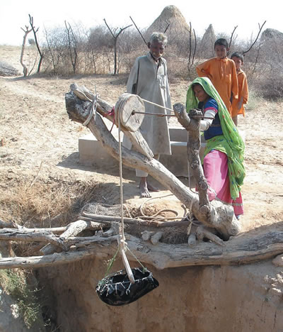A Pakistani family at the well