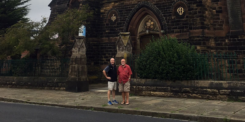 Fr. John Boles in front of Our Lady of the Immaculate Conception church.