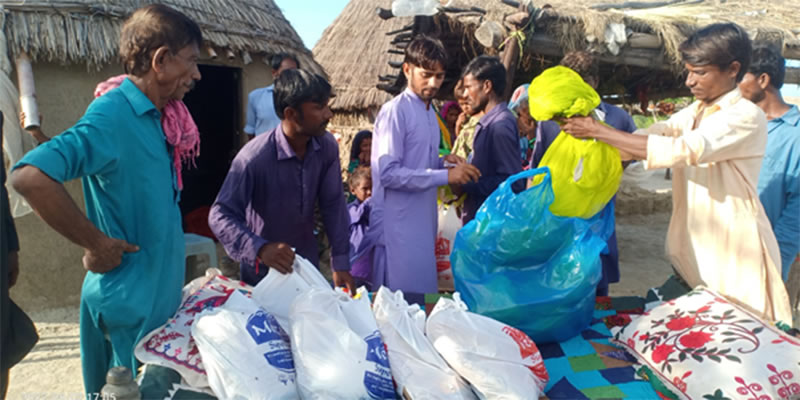 An isolated Christian family in Manori receives food ration.