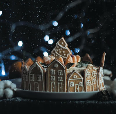 Gingerbread cookies decorated like a buildings in a town