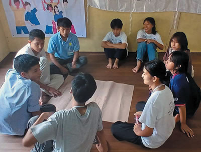 Participants in discussion at camp