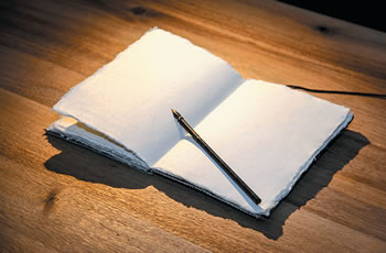 Open journal book and pen