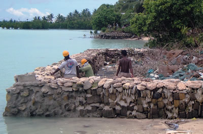 Constructing a sea wall, Kiribati