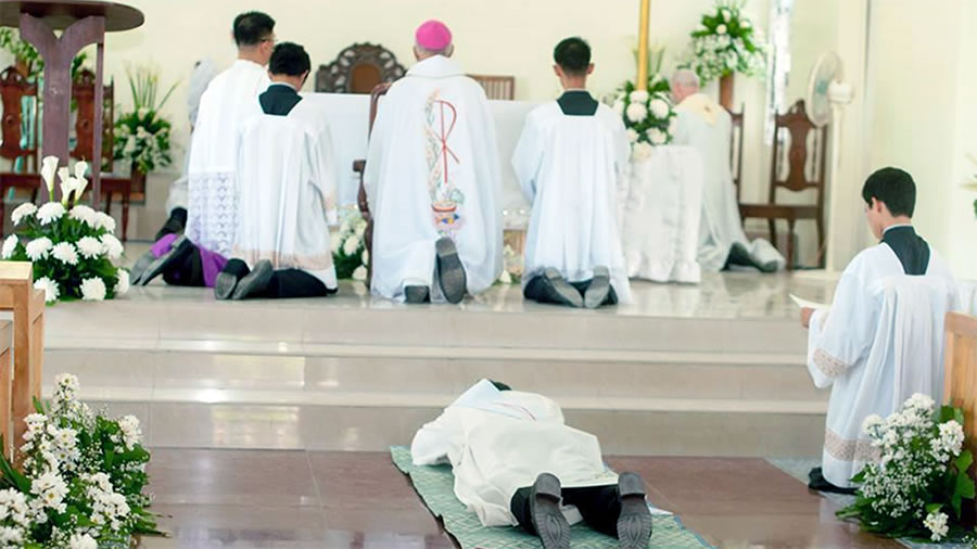 Fr. Kurt Zion Pala prostate on the floor at his ordination