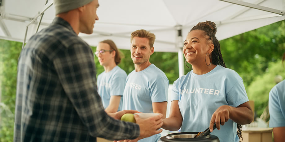 Volunteers serve food