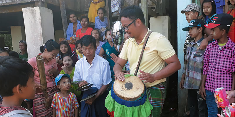 Fr. Kurt Zion Pala with with students and teachers at the village school.