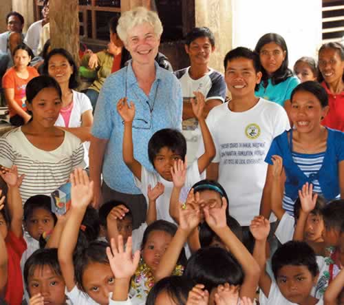 Sr. Kathleen, preschool teachers and children at the preschool