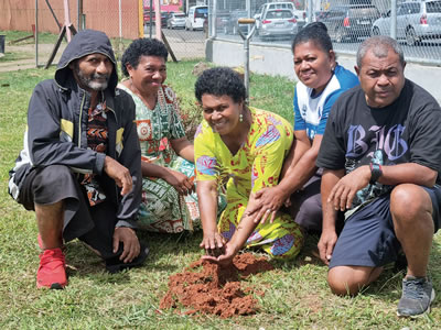 Parish Council members planting a tree during the Season of Creation