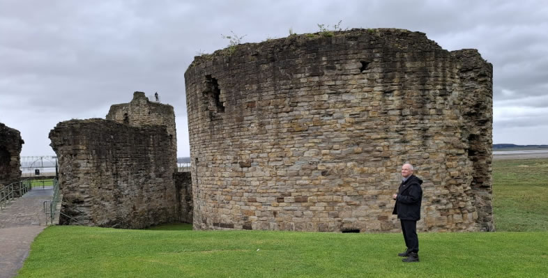 Fr. John Boles outside the Great Keep of Flint Castle, built by Edward I in 1277