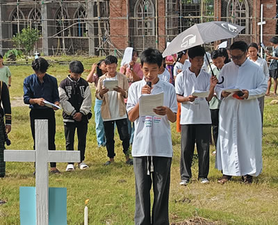 Students reading at one of the crosses