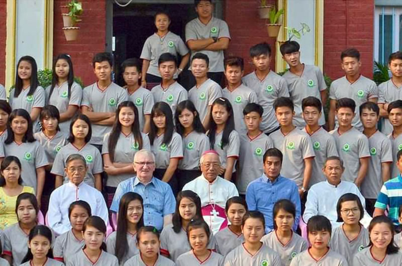 Fr. Neil Magill and Bishop Paul Grawng with HEC students in Myanmar.