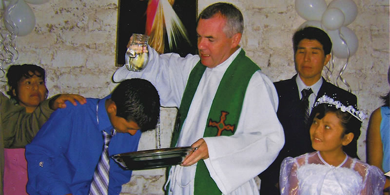 Columban Fr. John Boles Baptizes a chile