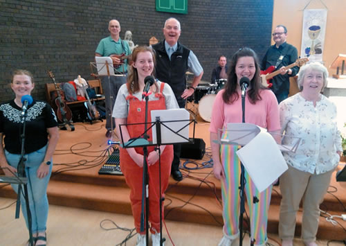 Fr. Boles with members of the "Tongues of Fire" rock band in the Wavertree parish church