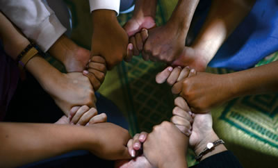 hands joined together in a circle