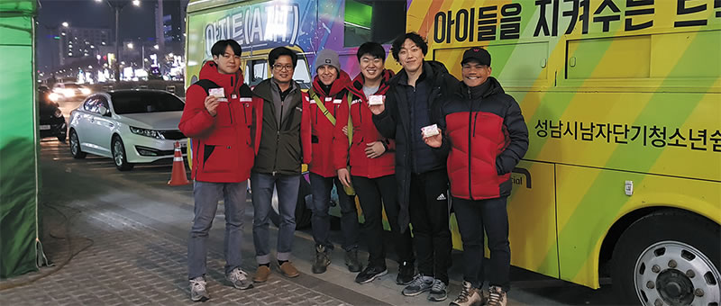 Fr. Vincenzo and his team with the bus