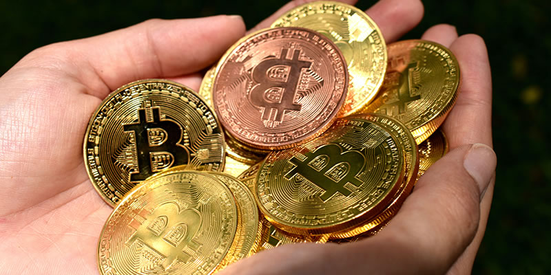hands full of gold coins