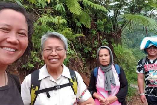 Columban missionaries Sr. Ashwena Apao (left) and Sr. Minerva Dangaran (second from left) and friends in the Philippines.