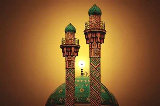 Two spires peek above a green dome of a building