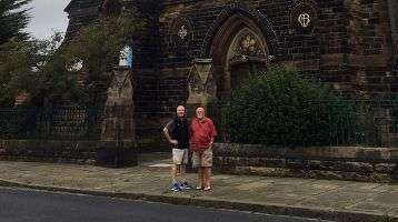 Fr. John Boles in front of Our Lady of the Immaculate Conception church.