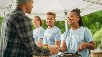 Volunteers serve food