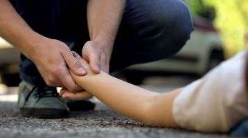 Good Samaritan helping an injured person