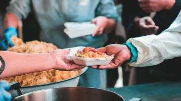 Volunteers serve food