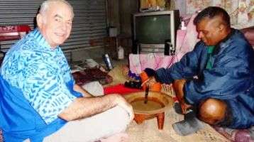 Fr. Frank Hoare drinking yaqona with an Indo-Fijian friend.