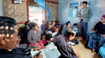 The head of the family says his prayer intentions during the church group