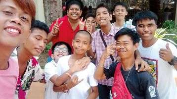 Columban Lay Missionary Lanieta Tamatawale (back row, in red) with members of the deaf community in the Philippines.