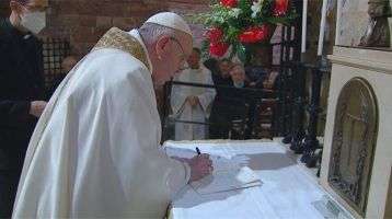 Pope Francis signing the Encyclical, Fratelli Tutti