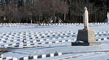 Snow blankets a cemetery 