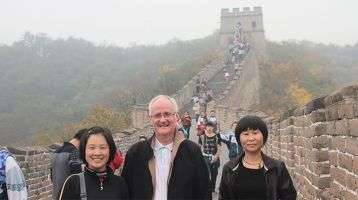 Fr. Alo Connaughton with students at the Great Wall of China
