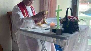 Fr. Borque celebrates Mass in a home.