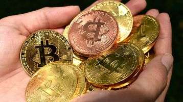 hands full of gold coins