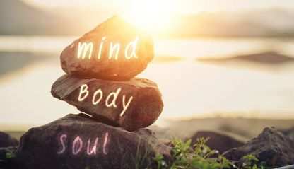 stacked rocks with words mind, body, soul