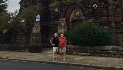 Fr. John Boles in front of Our Lady of the Immaculate Conception church.