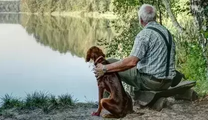 Man and dog by a lake