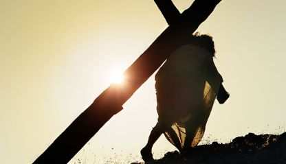 Jesus carrying the cross up a hill