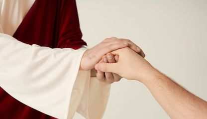 Jesus clasping the hand of a person.