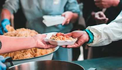 Volunteers serve food