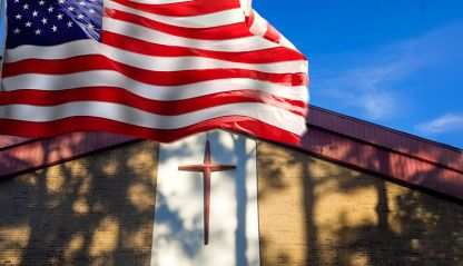 American Flag flying in front of a church