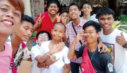 Columban Lay Missionary Lanieta Tamatawale (back row, in red) with members of the deaf community in the Philippines.