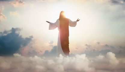 Resurrected Jesus Christ ascending above the sky and clouds