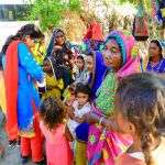 Flood victims wait for food rations