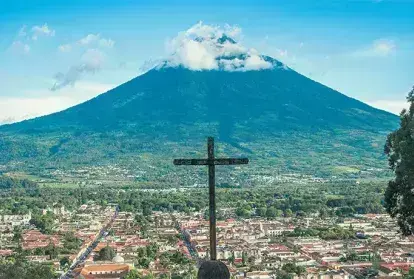 A cross overlooking the city of Livingston, Guatemala