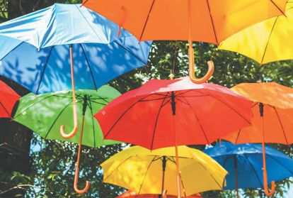 Colorful umbrellas float in the air