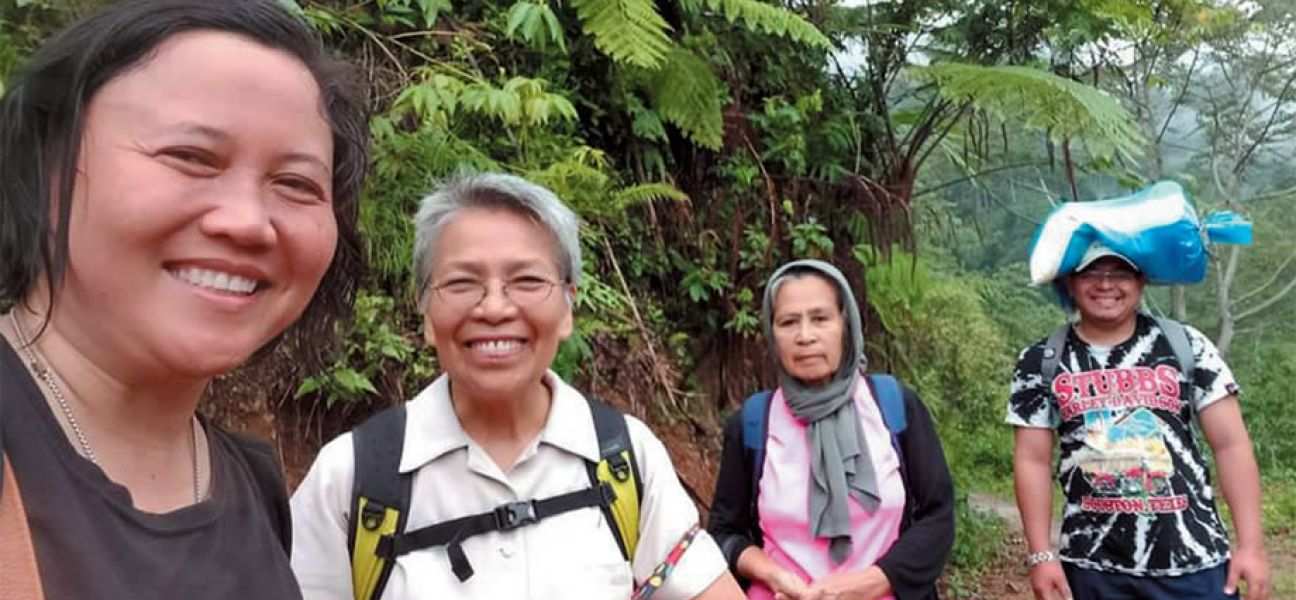Columban missionaries Sr. Ashwena Apao (left) and Sr. Minerva Dangaran (second from left) and friends in the Philippines.