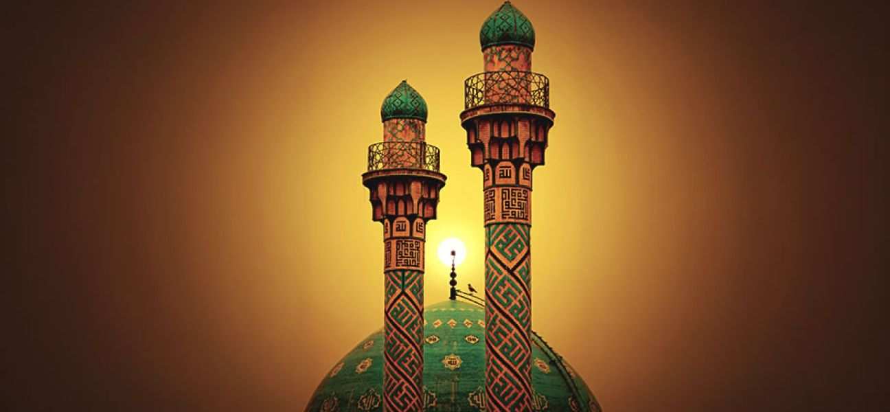 Two spires peek above a green dome of a building